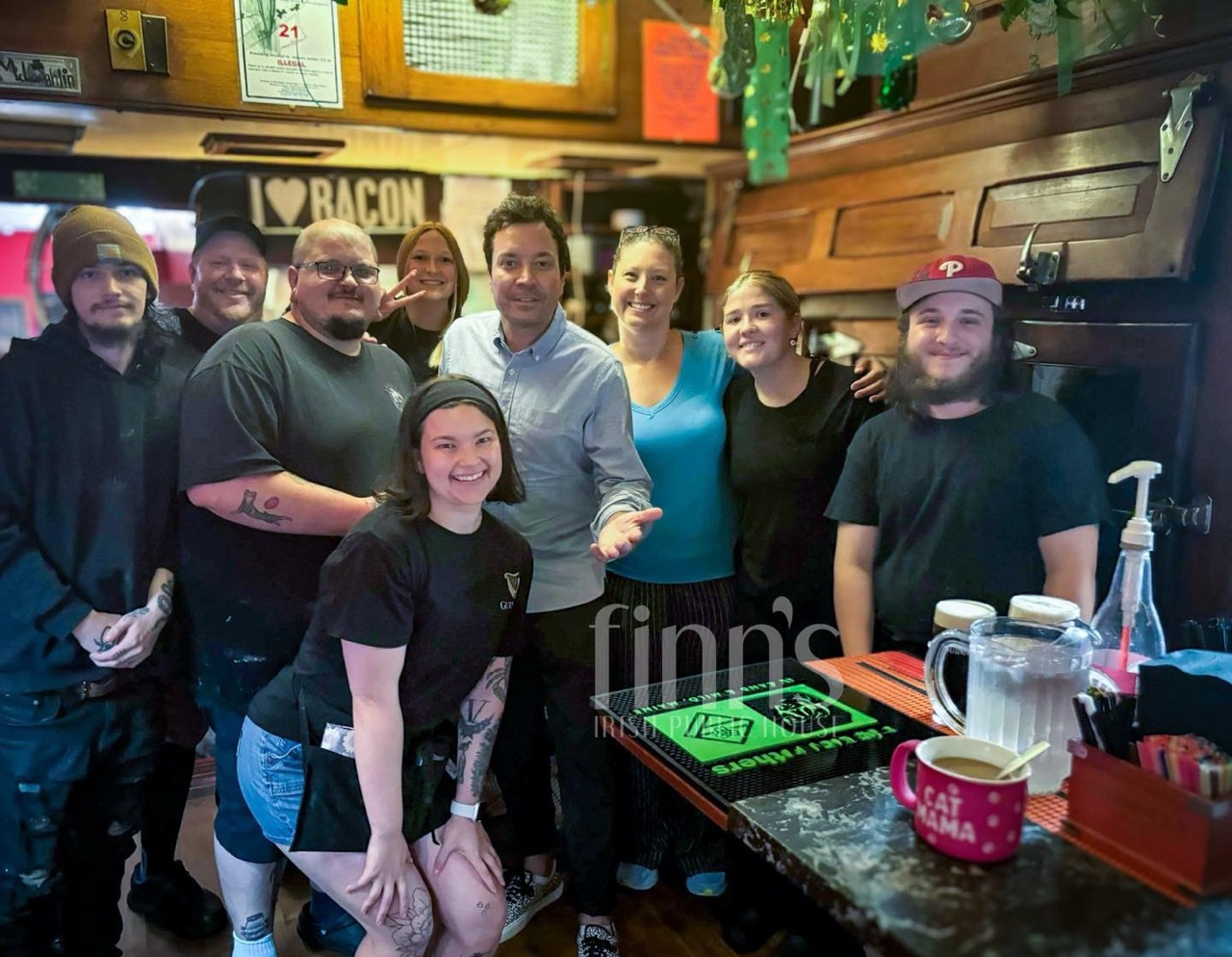 Jimmy Fallon with members of the Finn’s staff behind the bar